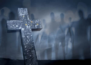 ghosts walking by grave with cross in fog