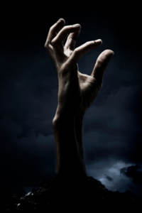 hand reaching up out of grave