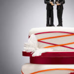 Non-religious wedding venues might have two male cake toppers.