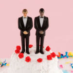 Two groom figures on a wedding cake