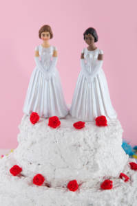 Same-sex wedding cake with lesbian cake topper