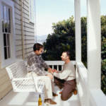 Man proposing to his partner on patio