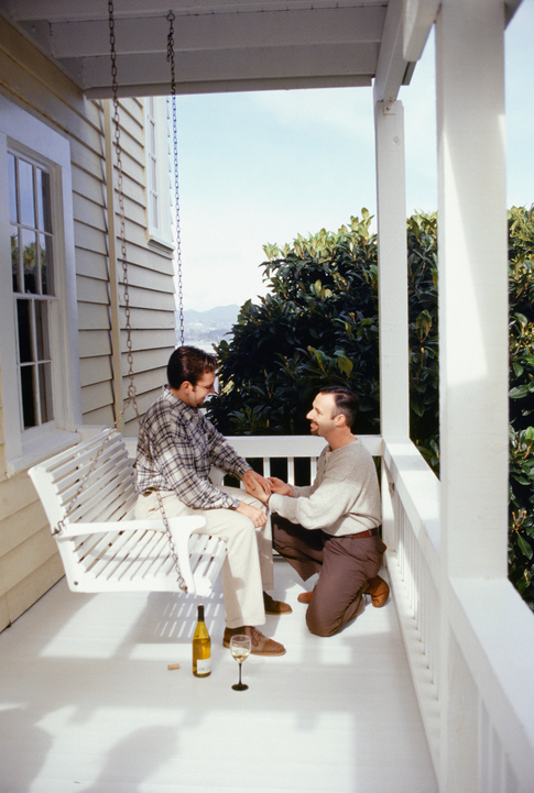 Man proposing to on patio