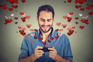 man using mobile phone to meet their future spouse through online dating