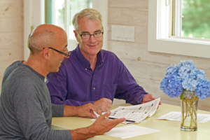 older gay couple sitting at table