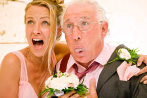 Man and woman experiencing an uncomfortable wedding mishap