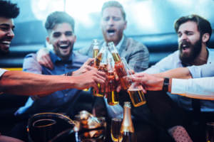 Men drinking beer at a bachelor party