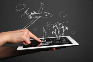 A person using a tablet to book their honeymoon