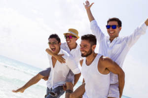 men playing on beach gaily