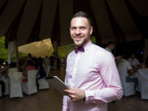 A wedding emcee with tablet