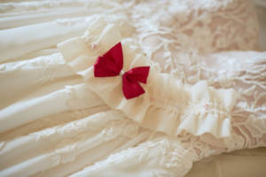 A wedding dress and garter waiting for reveal