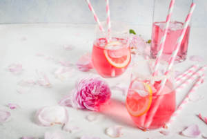 A signature wedding day cocktail with rose petals