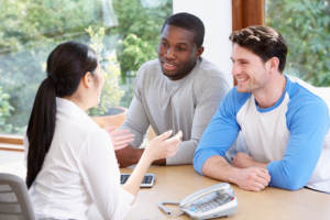 A newlywed couple discussing their finances.