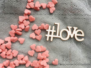 A wedding hashtag with candy hearts