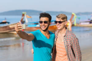 A couple posting on social media while enjoying their honeymoon