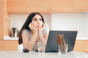 A woman indulging in procrastination rather than planning for her wedding