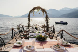 A wedding reception table with a lakefront view making for a picturesque destination