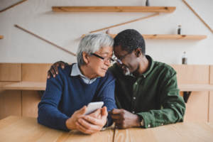 Older gay couple reading steps for developing their relationship