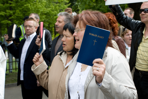 Christian group holding bibles