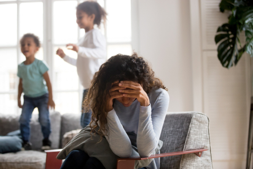 stressed woman with children