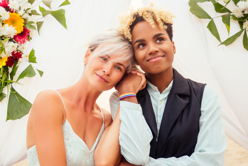 same-sex couple thinking about the wedding planning mistakes they avoided