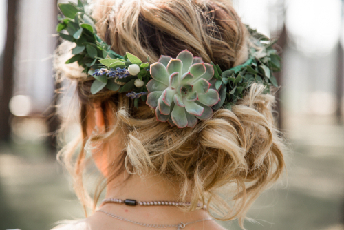 Woman wearing a floral crown is one of many wedding rituals that can be incorporated into your ceremony.