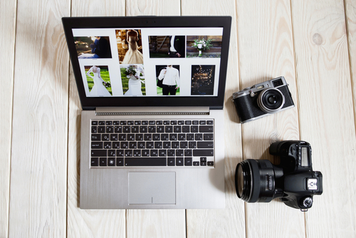 Wedding photographer laptop and cameras