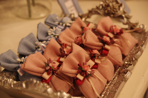 blue and pink wedding favors on display 