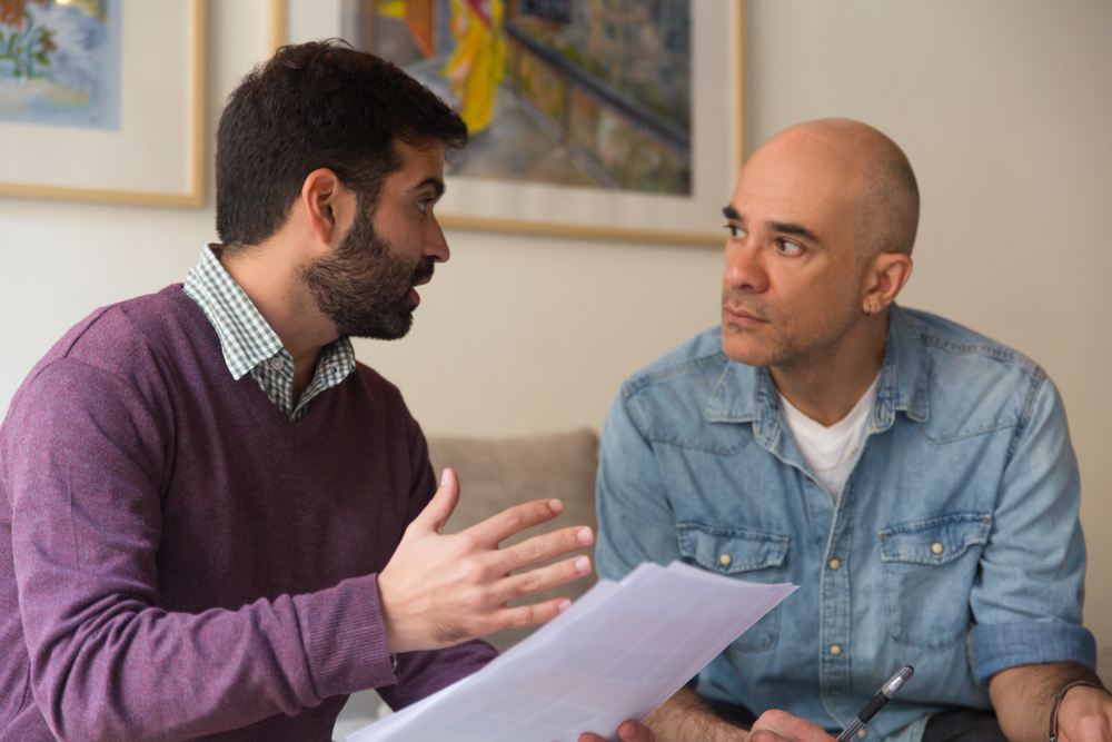 LGBTQ+ couple going over the topics they should discuss before getting married