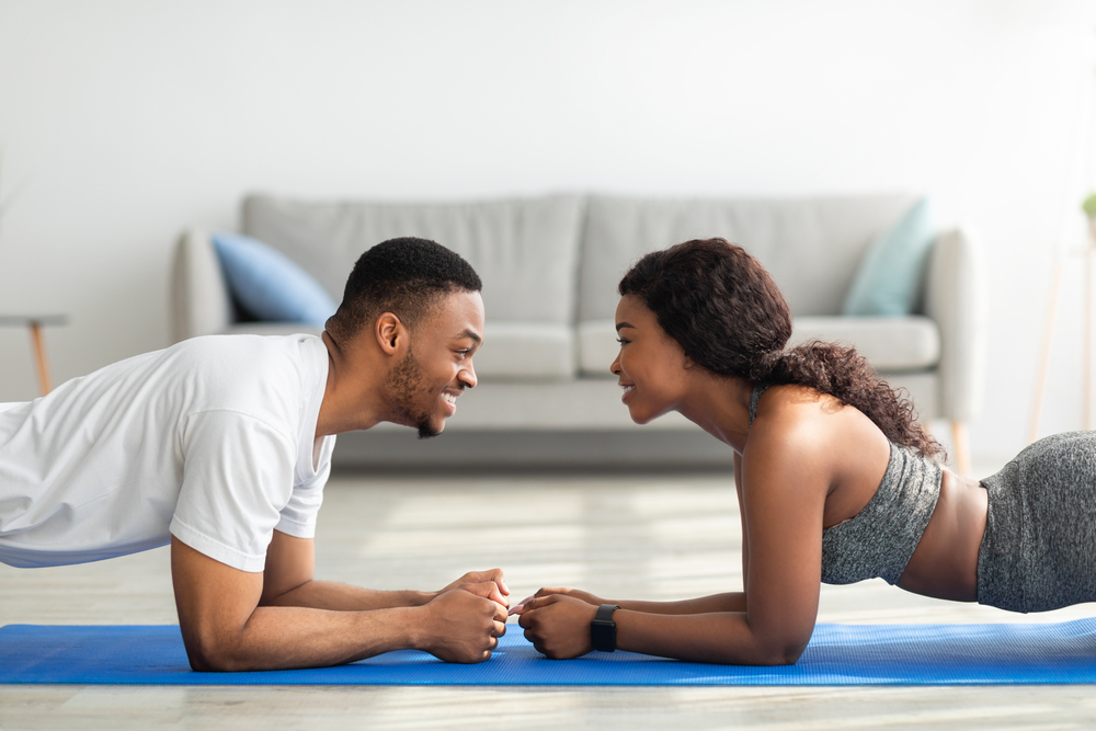 Black couple exercising together to stay healthy