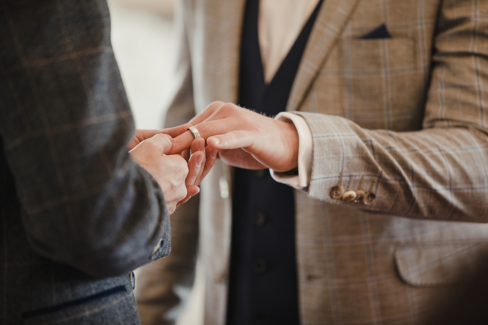 A same-sex couple exchanging wedding rings is something you can write about.