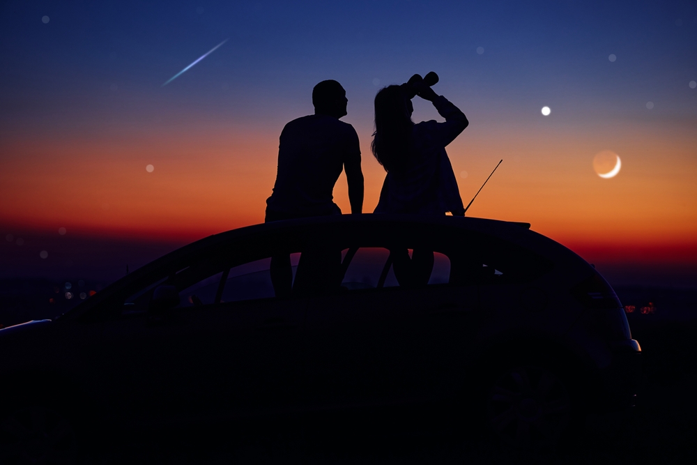A fun way to connect with your partner is stargazing together at sunset on your car 